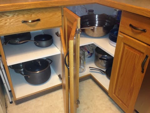 Pots, sauce pans, mixing bowls, storage space.