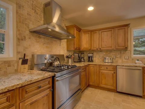 Cozy kitchen with rustic stone accents and modern appliances