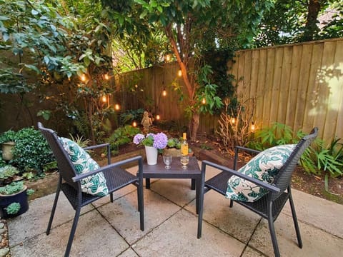 GARDEN APARTMENT PRIVATE COURTYARD WITH FESTOON LIGHTING..