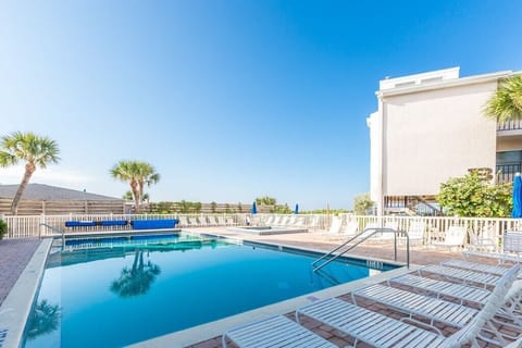 Relax at the pool, adjacent to the beach.