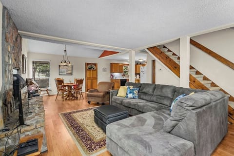 Downstairs has living room with fireplace, kitchen and a bathroom