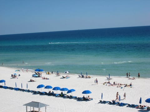 COMPLIMENTARY BEACH SERVICE-Mid March- Mid Oct. 1 Double Wood Lounge with Cushions & Umbrella 