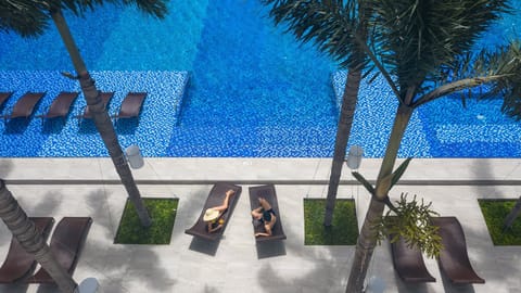 Outdoor pool, open 6:00 AM to 9:00 PM, sun loungers