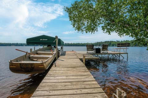 Expanded dock with our rowboat, fishing boat, + lots of room for your boat(s)!