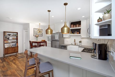 Kitchen, living room and dining nook in a large open floor plan.