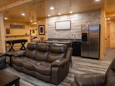 Basement Lounge area, 70" TV, wet bar, kids play area, full size fridge/freezer