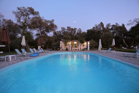 Seasonal outdoor pool, open 11:00 AM to 8:00 PM, pool umbrellas
