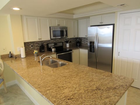 Kitchen (washer and dryer hidden in cupboard)