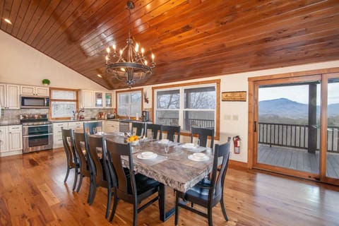 Wall of Windows frame Mountain Views from Kitchen, Dining, Great Room of Stone Ridge Lodge!