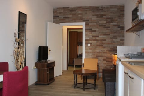 Economy Apartment, 1 Bedroom, Terrace, Ground Floor | Living area | 80-cm LCD TV with satellite channels, TV