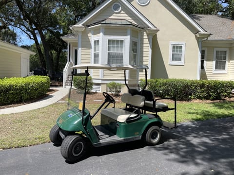 Front of house with Golf Cart