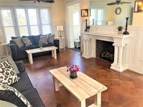Large turn of century fireplace and connecting doors to sun room!