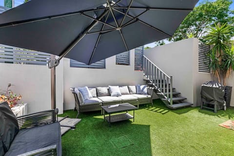 Large, light-filled private courtyard with outdoor setting.