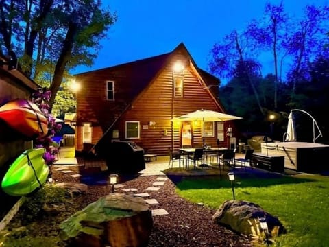Rear patio night view looking like a cabin from your childhood fairytale