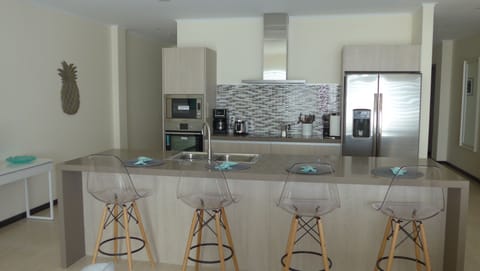 Spacious open concept kitchen with eat-in island