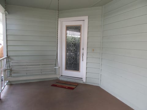 Front door with porch swing