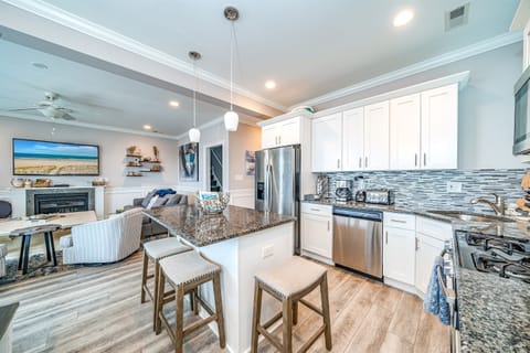 Stunning chef’s kitchen with granite island and dining area