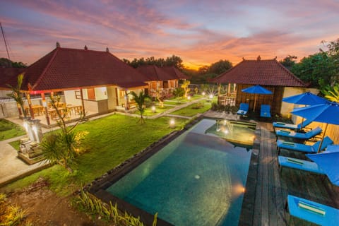 Outdoor pool, open 7:00 AM to 7:00 PM, pool umbrellas, sun loungers