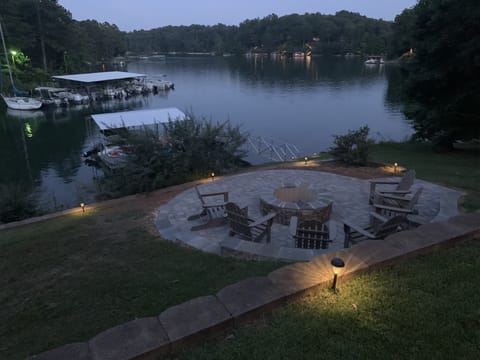 Enjoy evenings around wood burning fire pit overlooking the lake!!
