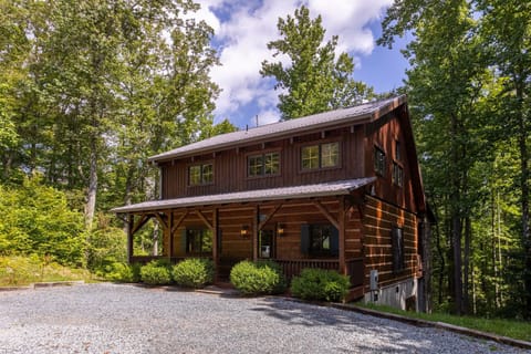 Tucked into the trees just outside Boone, Walk In The Clouds welcomes you with warm wood siding and a shady covered porch.