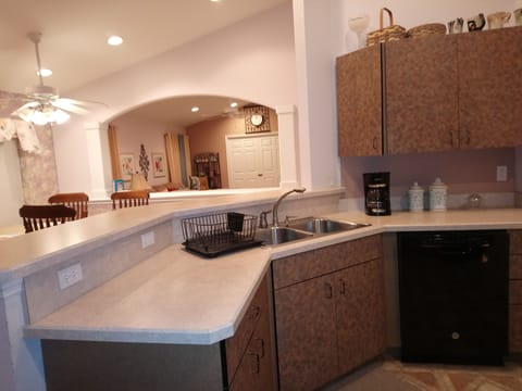 Kitchen with open view of dining room and living room