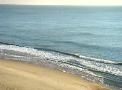View of beach from balconies in living room and master bedroom
