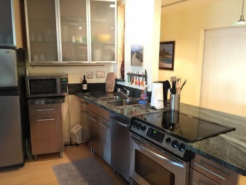 The kitchen, with the hallway behind leading to the second bathroom.