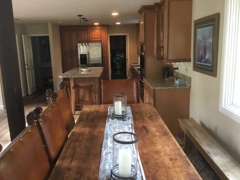 Dining table for 8-10 people, open to kitchen