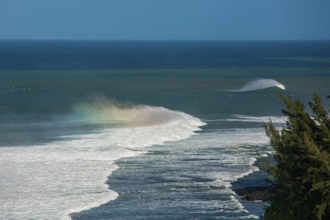 The first of the winter surf with the rainbow caught in the wave