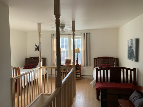 Loft with 2 twin beds and a queen.  