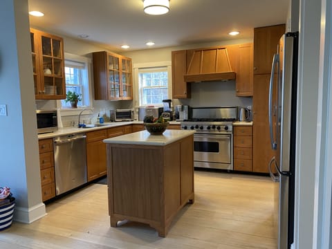 Fully equipped/stocked kitchen plus adjacent laundry area/pantry