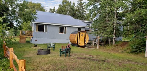 A view of the Sauna, firepit, lakeside deck, hammock and BBQ/Picnic deck.