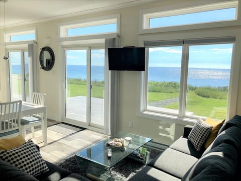 Enjoy amazing ocean views from the living room which is flooded with natural light