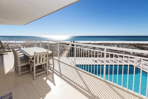 Private balcony with direct beach and pool views