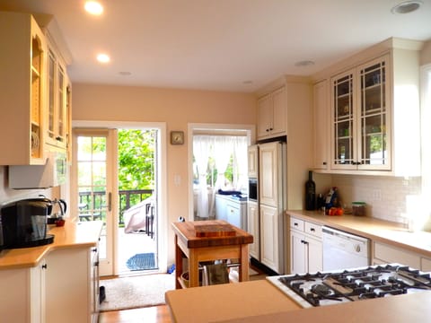Fun open  kitchen serves deck, dining room,  and living room.