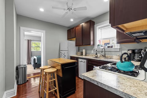 This ample space kitchen opens into the rear bedroom