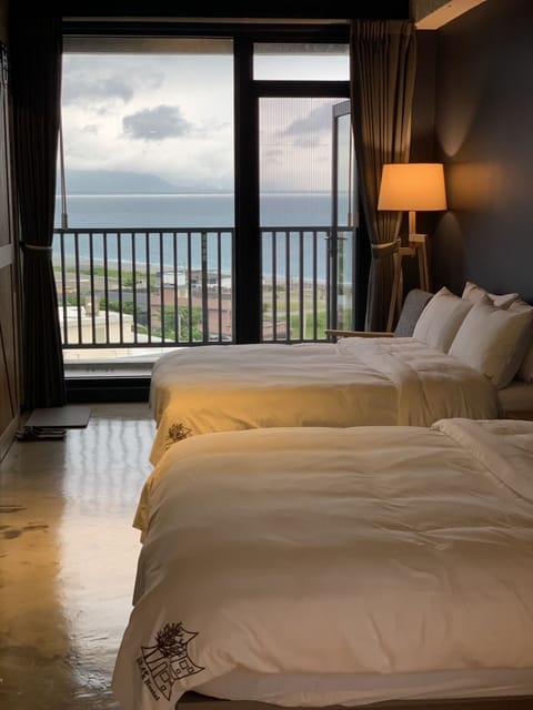 Deluxe Quadruple Room, Non Smoking, Ocean View | Premium bedding, down comforters, blackout drapes, soundproofing