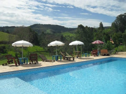 Outdoor pool, open 8:00 AM to 10:00 PM, sun loungers