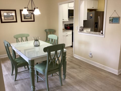 Dining room table looking into the kitchen
