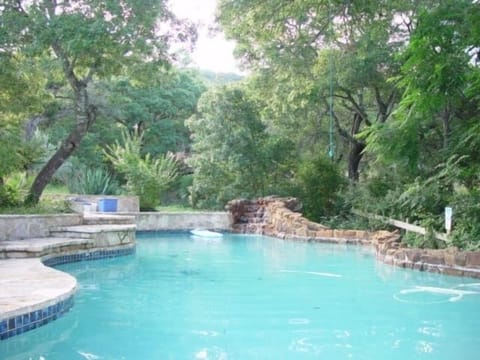 Large Private Pool with Waterfall. Seating all around and built into a ravine
