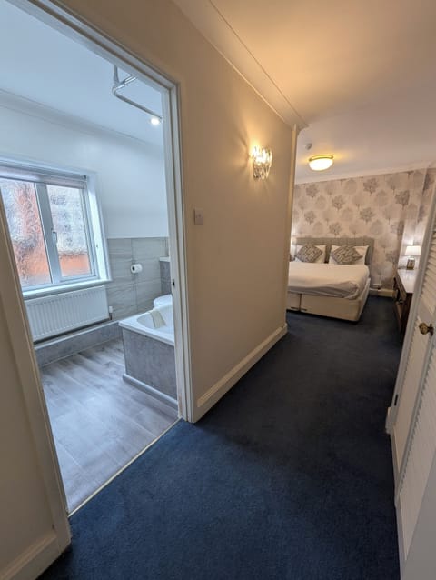 Family Room | Blackout drapes, iron/ironing board, free WiFi, bed sheets