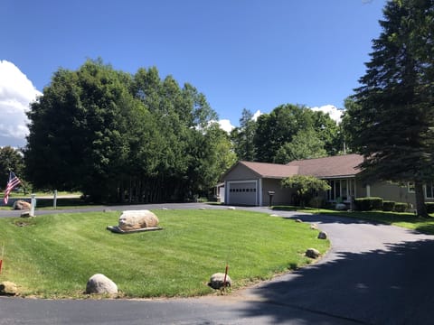 Front of house, circle drive, 2-car garage. Room for trailer, boat, RV.