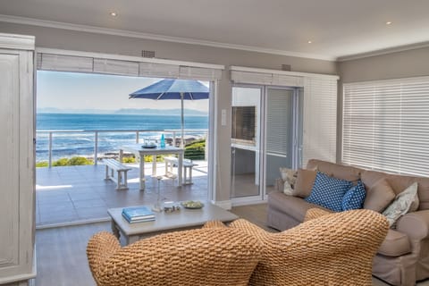 Superior House, 4 Bedrooms, Sea View, Oceanfront | Living area | 50-inch flat-screen TV with satellite channels, TV, fireplace