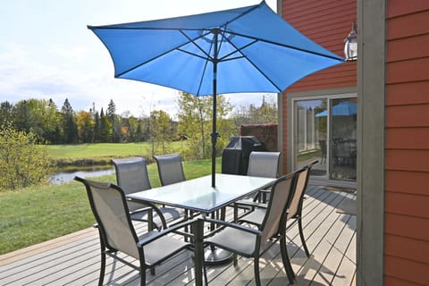 Large patio w/ outdoor seating & umbrella for sunny days.