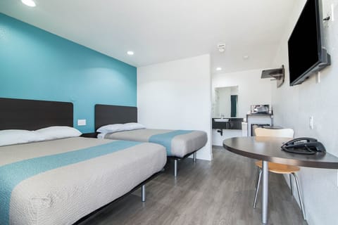 Desk, laptop workspace, free WiFi, bed sheets