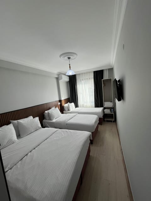Basic Quadruple Room | Premium bedding, soundproofing, free WiFi, bed sheets