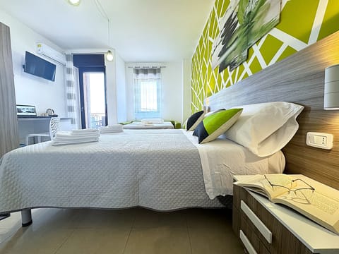 Deluxe Quadruple Room, Non Smoking | Desk, blackout drapes, free cribs/infant beds, free WiFi