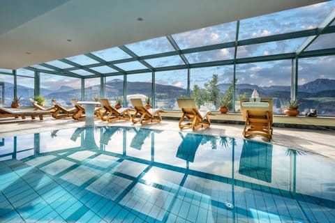 Indoor pool, seasonal outdoor pool, pool umbrellas, sun loungers