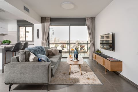 Deluxe Apartment, 3 Bedrooms | Living room | Flat-screen TV