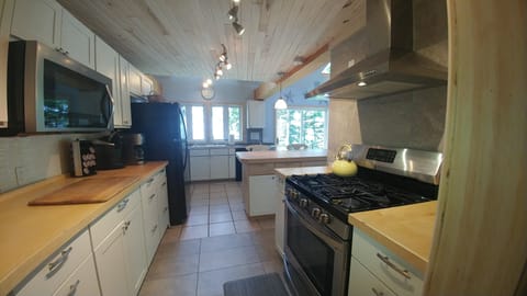 Kitchen view from gallery hallway entrance.